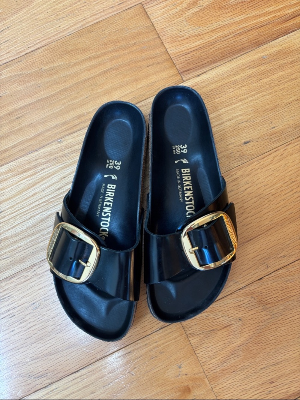 Birkenstock Black Single-Strap Slides with Gold Buckles
